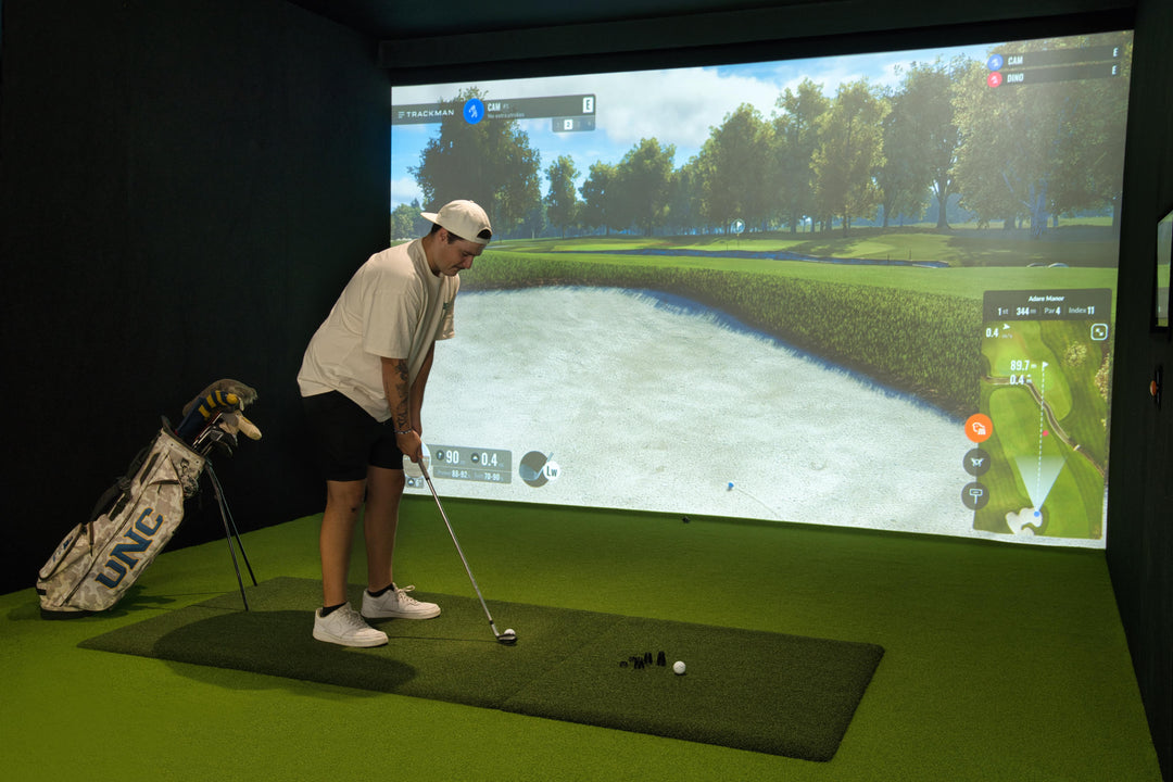 Golfer practicing at Noosa Golf Co. using TrackMan simulator on the Sunshine Coast. Included in the weekly membership plan with access to indoor training, premium facilities, and virtual course play.