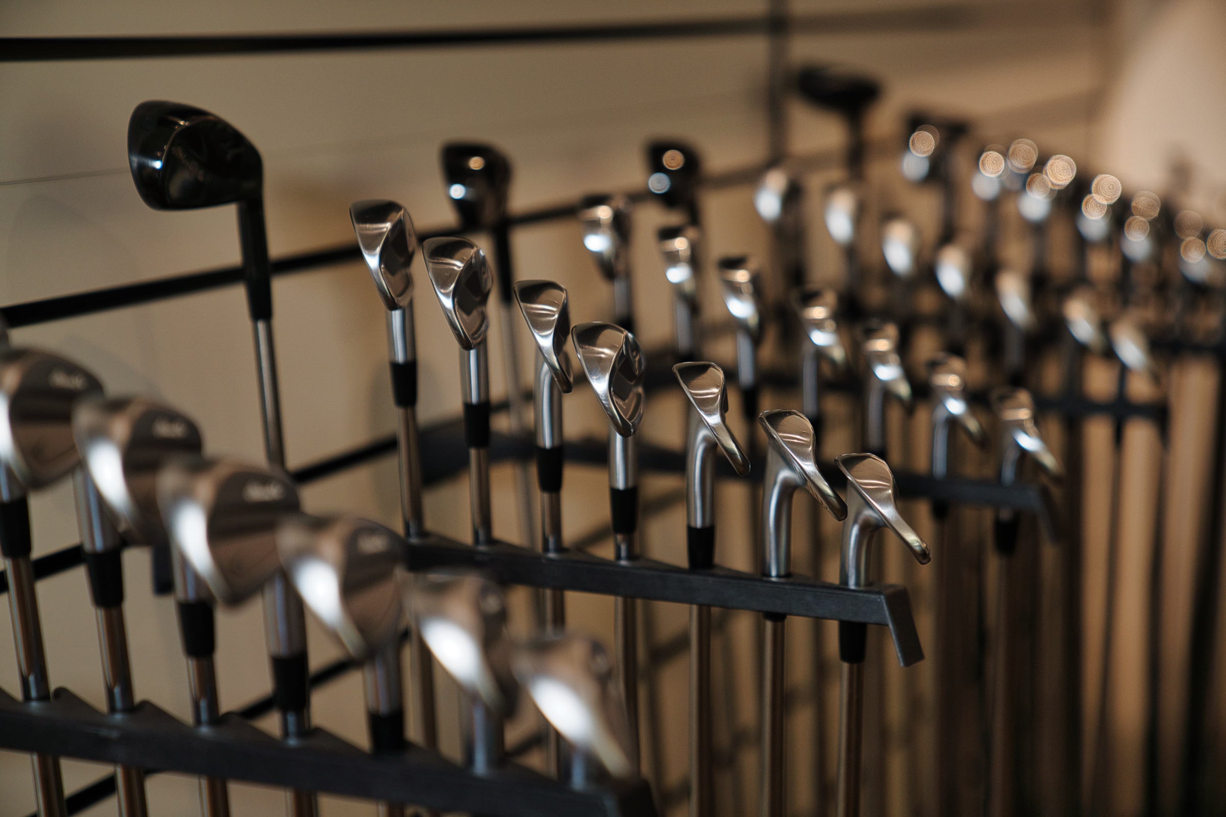 Close-up of premium Mizuno golf clubs at the Club Fitting Centre inside Noosa Golf Co., a leading Noosa and Sunshine Coast golf shop offering custom fit gear and expert fitting services.