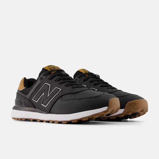 Angled front shot of New Balance 574 golf shoes in black and tan. Available at Noosa Golf Co., your Sunshine Coast destination for premium golf shoes.