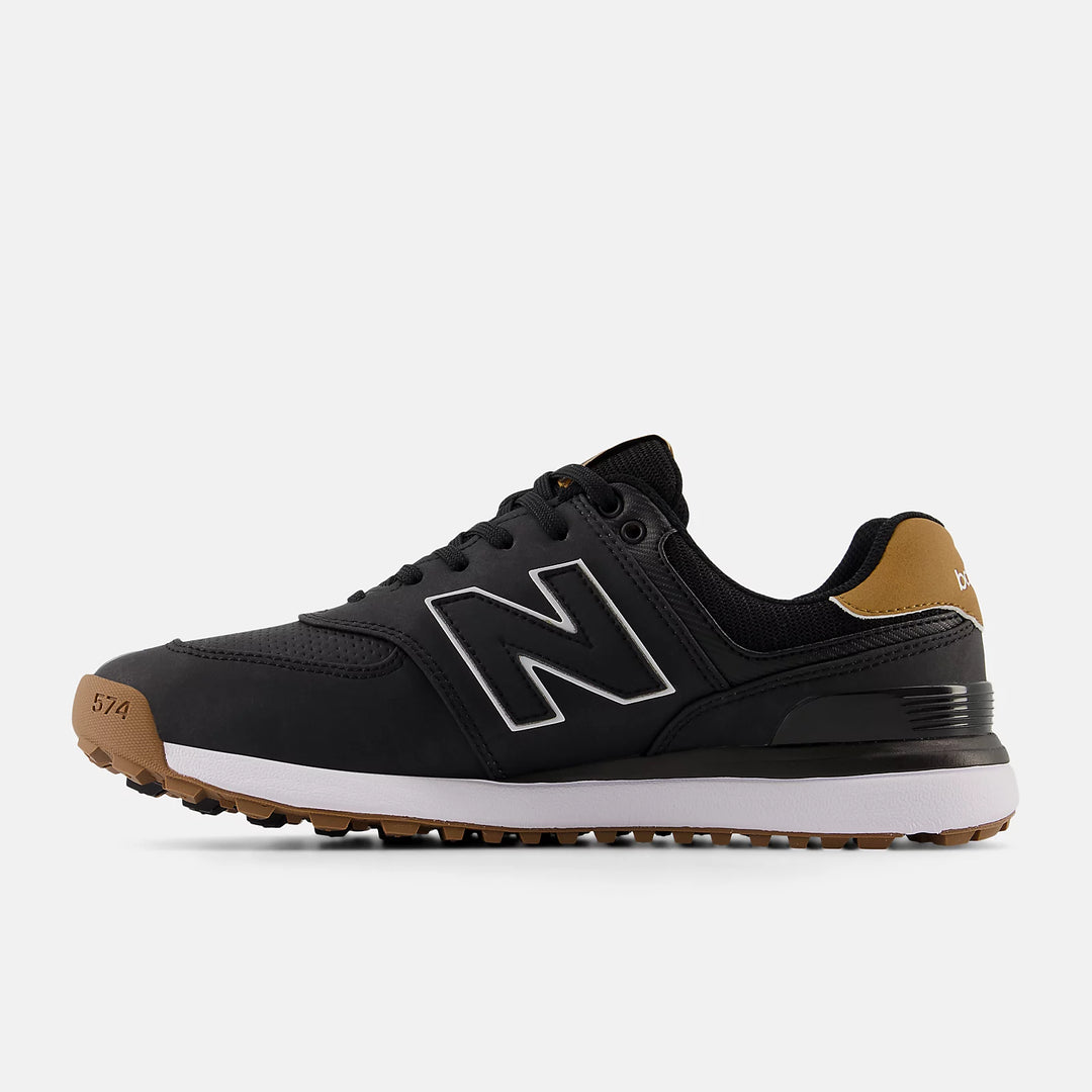 Side profile of New Balance 574 golf shoes in black with tan heel and white midsole. Shop golf shoes at Noosa Golf Co., premium Sunshine Coast golf shop.