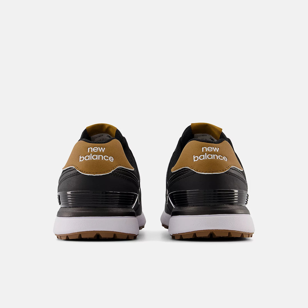 Back view of New Balance 574 golf shoes showing dual heel branding in tan and black. Available now at Noosa Golf Co., Noosa’s go-to golf shop.