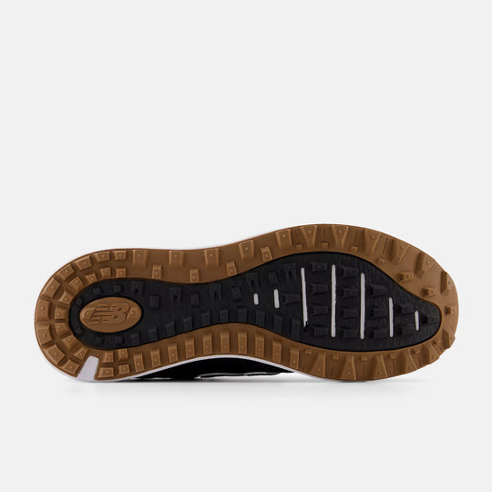 Outsole view of New Balance 574 golf shoes in black with rugged traction pattern. Available at Noosa Golf Co., your trusted golf shop in Noosa and Sunshine Coast.