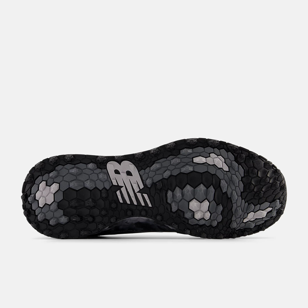 Hex-patterned outsole of the New Balance Fresh Foam Contend v2 golf shoe in black and grey camo, showing multidirectional grip design. Available at golf shop Noosa and Sunshine Coast.